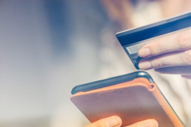 Person entering gift card info on phone
