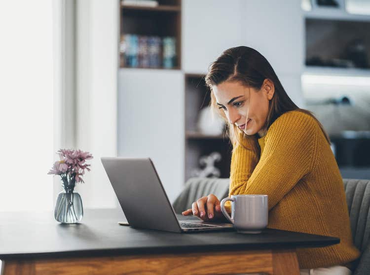 Woman typing on laptop