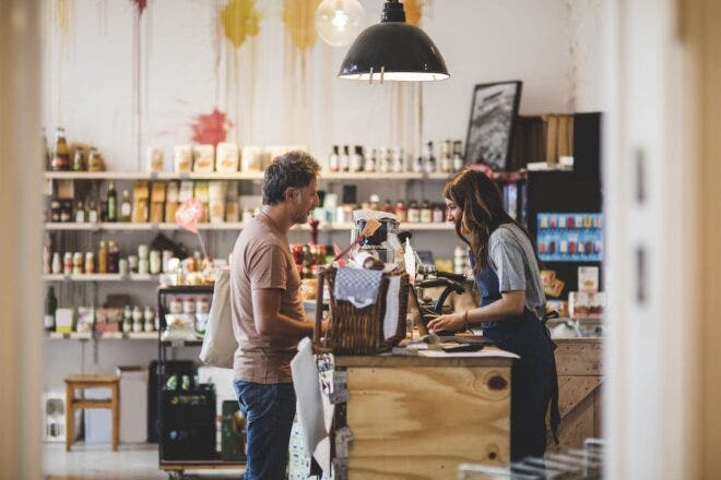 Customer checking out at shop
