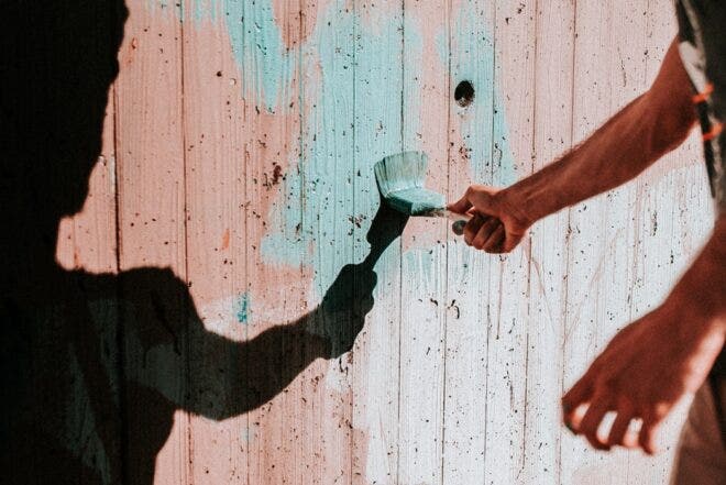 Painting a wooden fence