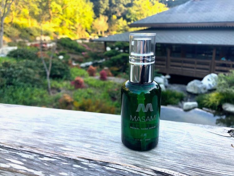 Shine Serum bottle outdoors in landscape