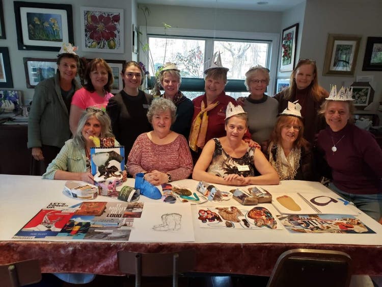 Art as Therapy workshop participants with self-made hats