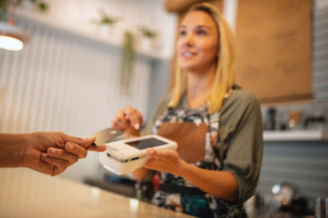 Woman with wireless credit card machine