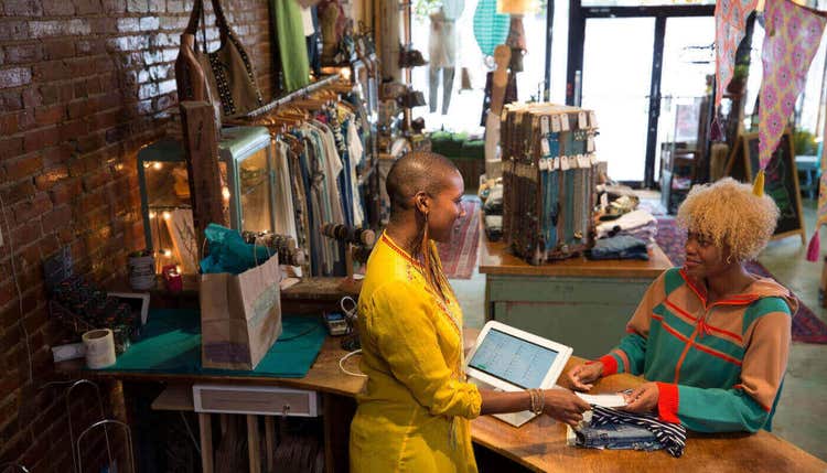 Woman paying by check