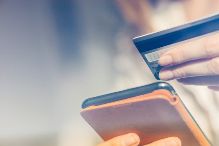 Person entering gift card info on phone