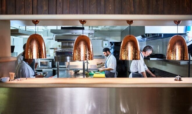 Chefs working in restaurant kitchen