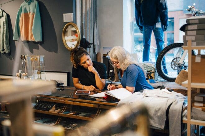 Retail shop owners discussing finances