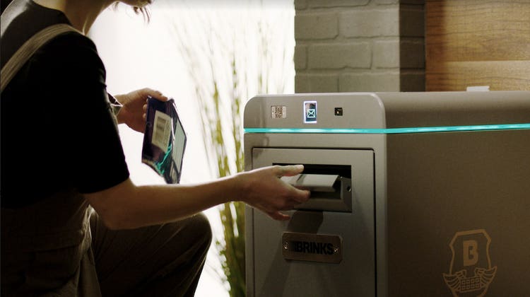 Woman opening BLUbeem by Brinks device