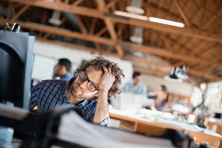 Employee looking frustrated in the office