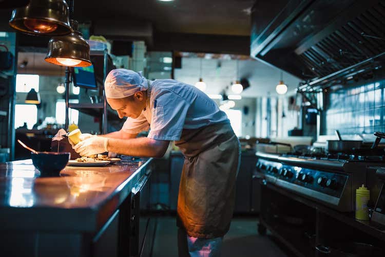Chef plating an entree