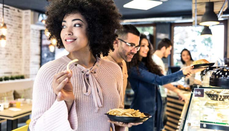 People waiting in line for food