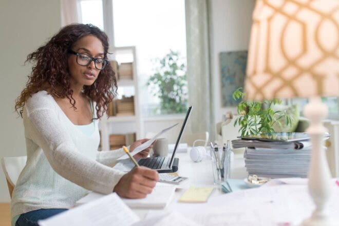 Woman writing in notebook