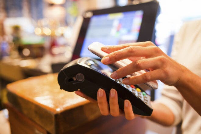 Holding phone over credit card reader