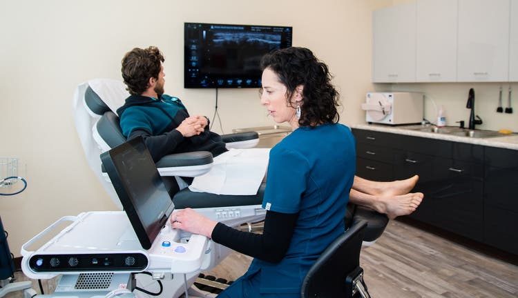 Dr. Jordanna Quinn working with a patient