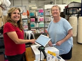 Owner and customer inside The Batty Lady store