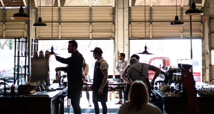 Workers and customers in a coffee shop