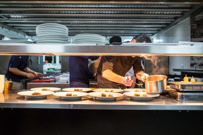 Chef plating food in restaurant