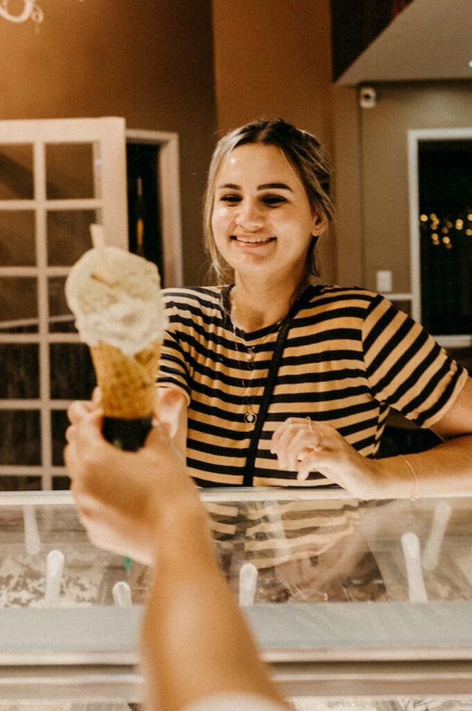 Woman ordering an ice cream cone