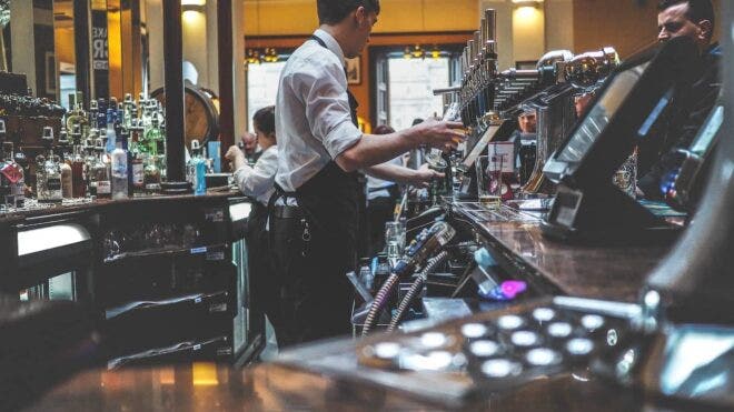 Bartenders serving drinks