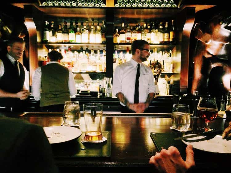 Bartenders behind bar