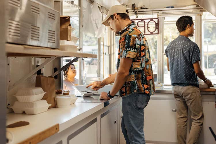 Food truck worker taking order on Clover Mini