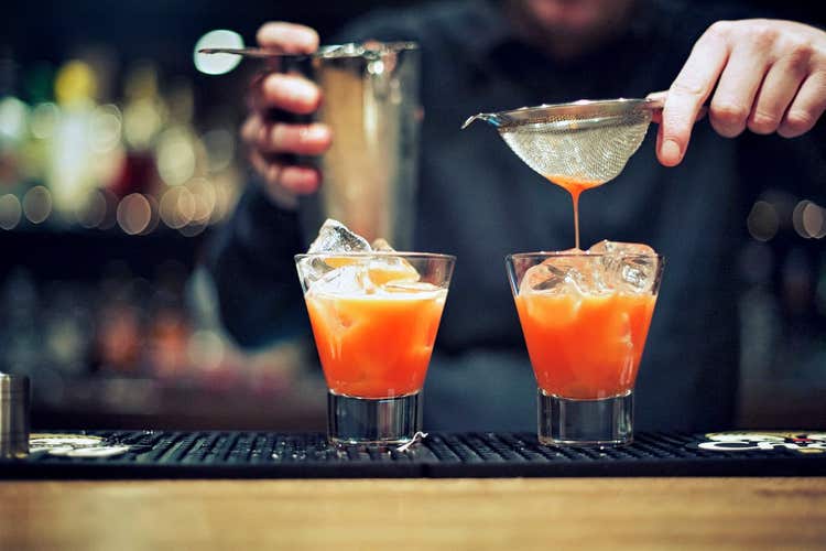 Bartender mixing drinks
