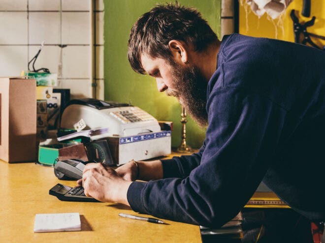 Man using calculator
