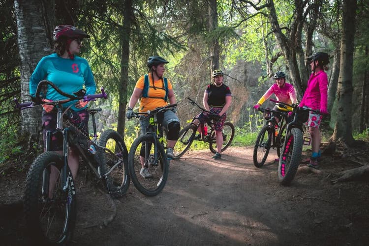 Women biking trails in Alaska