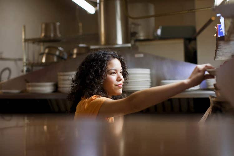Restaurant server taking dish