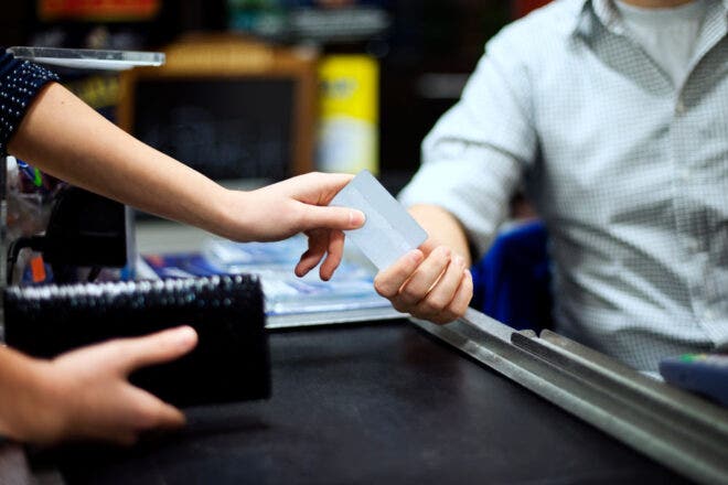 People exchanging a credit card