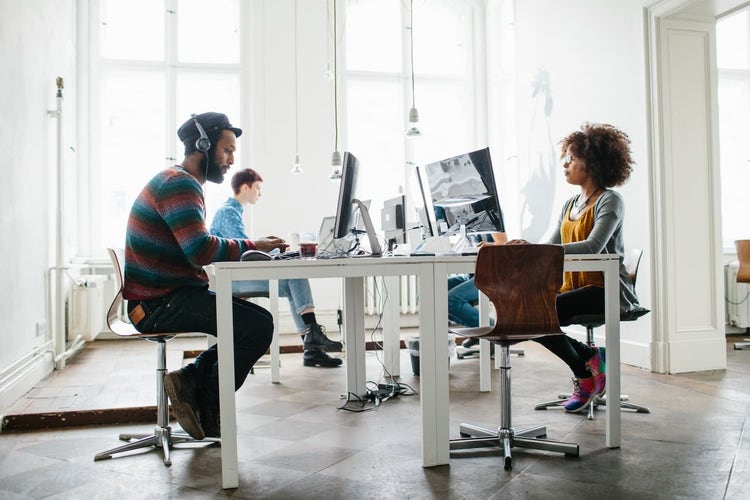 Employees sitting at workstations
