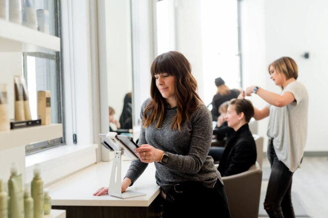 Staff and customers in hair salon