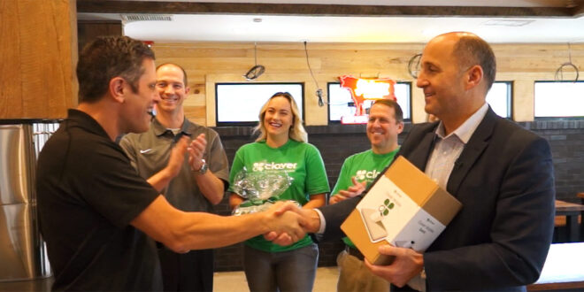 Shaking hands with Clover POS owner