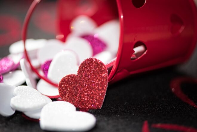 Glitter hearts spilling out of bucket