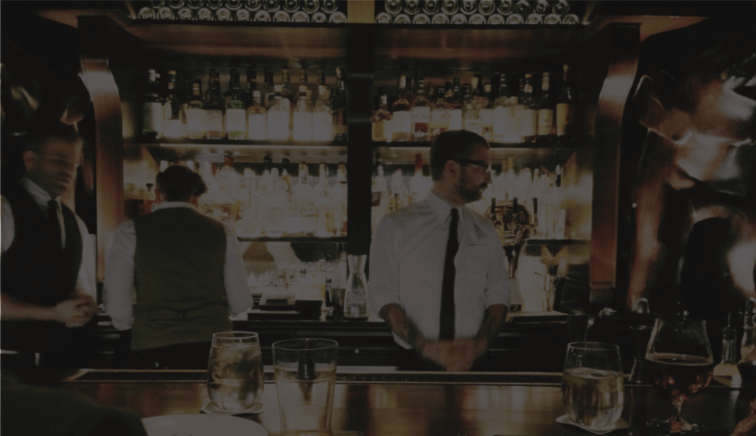 Bartenders behind bar