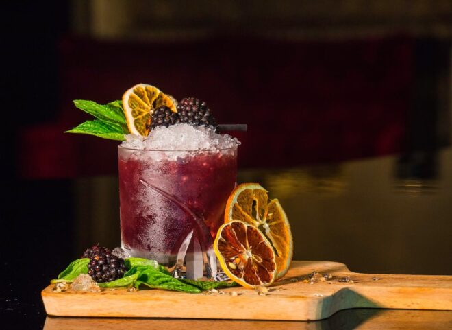 Purple cocktail with orange slices