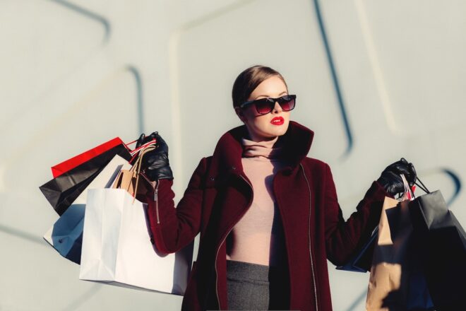 Stylish woman holding shopping bags