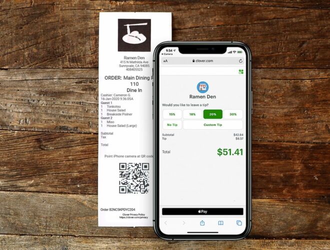 Restaurant receipt with phone using scan to pay feature