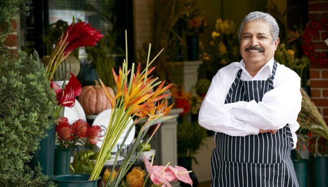 Hispanic business owner with his flowers