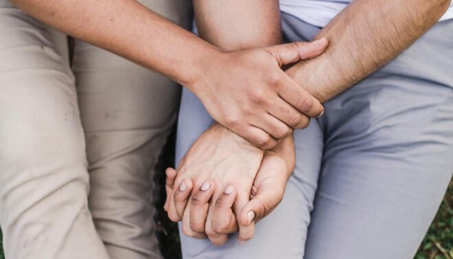 two people holding hands