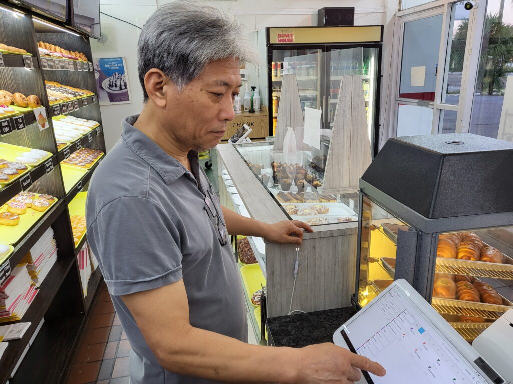 Donut shop owner using Clover Station Solo