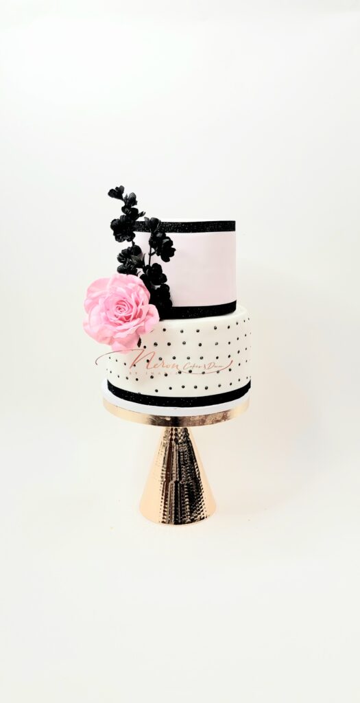 Pink and black cake from Neron Cakes