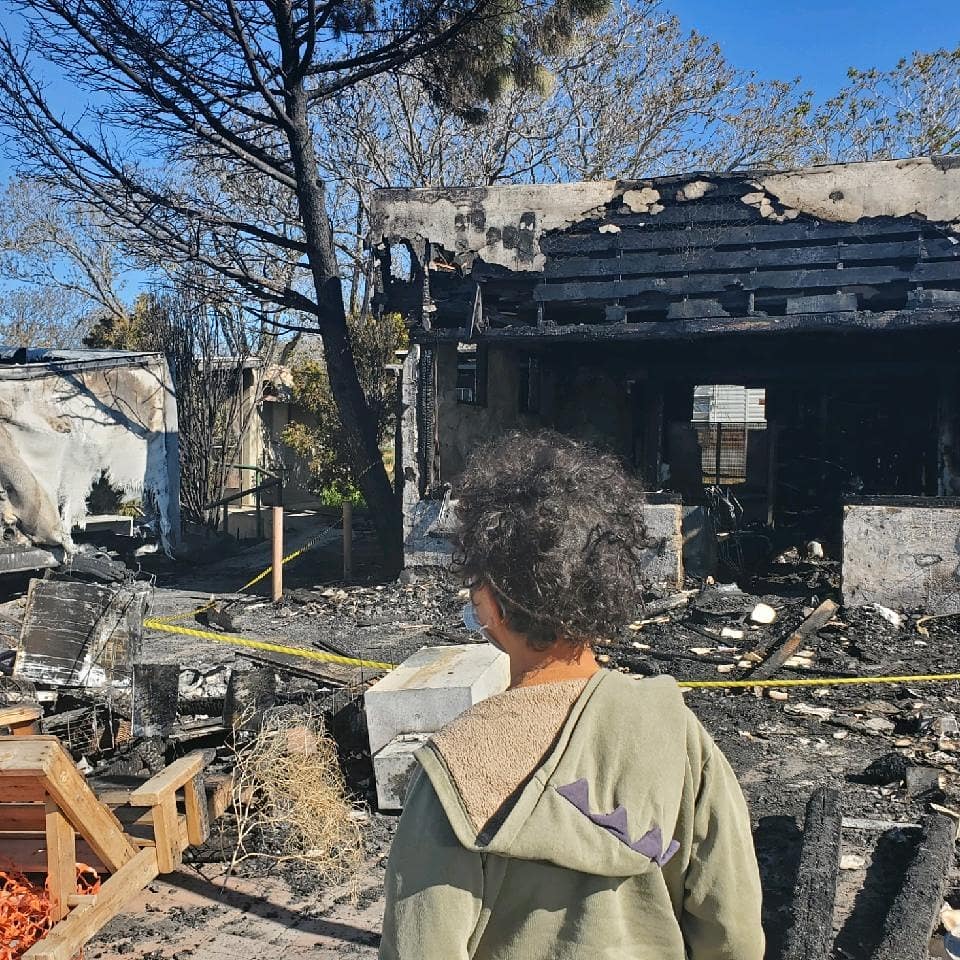 Person looking at fire damage