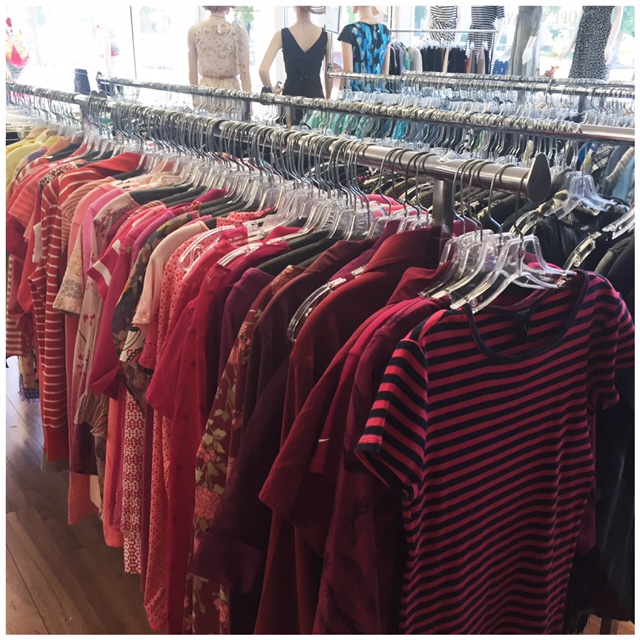 Rack of red women's tops at Alphabet Soup Stores