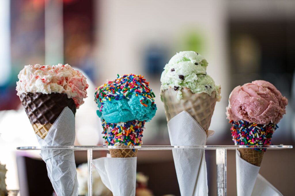 Four ice cream cones with different flavors