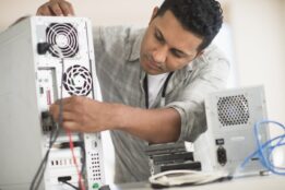 Man repairing desktop computer