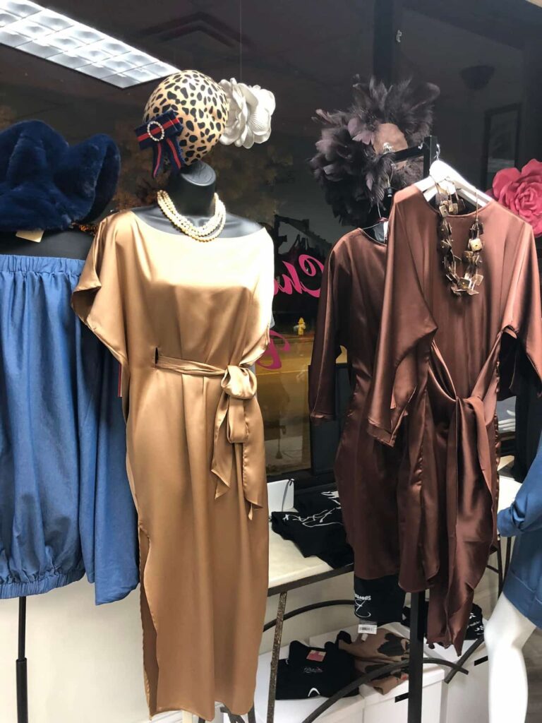 Gold and brown silk dresses in shop window
