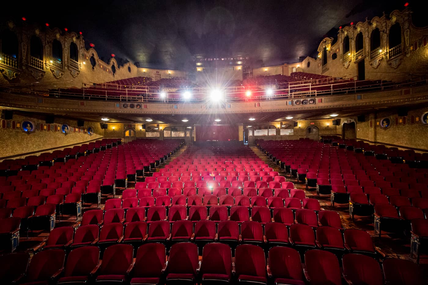 The Canton Palace Theatre interior with seating area, balconies, boxes, and lobby entrances