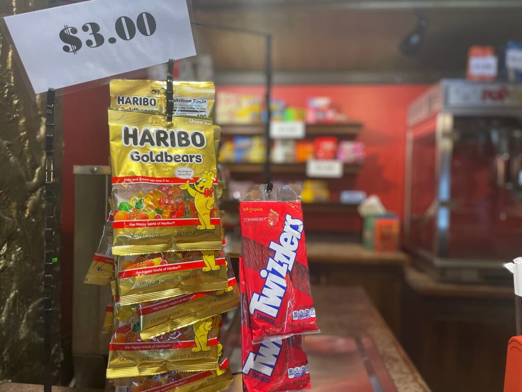 Concession stand with candy including Twizzlers and gummi bears