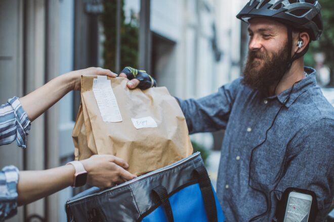 Man on bike delivering food order